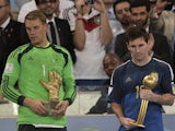 Germany's goalkeeper Manuel Neuer and Argentina's forward and captain Lionel Messi hold their respective trophies of 'Golden Glove' and 'Golden Ball' during a presentation ceremony after the final football match between Germany and Argentina for the FIFA 
