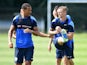 Rio Ferdinand and Jack Collison in a training session at QPR on July 18, 2014