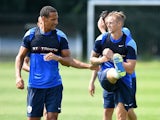 Rio Ferdinand and Jack Collison in a training session at QPR on July 18, 2014