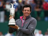 Northern Irishman Rory McIlroy holds the Claret Jug aloft after winning The Open at Royal Liverpool on July 20, 2014 in Hoylake, England