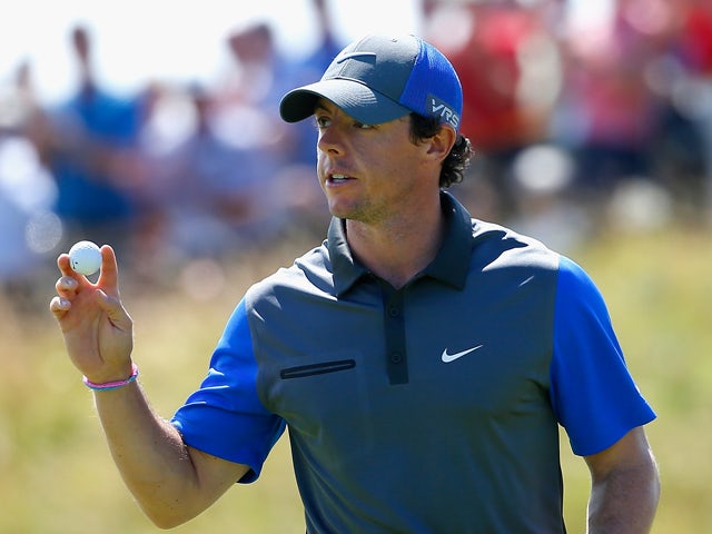 Rory McIlroy of Northern Ireland waves to the gallery during the first round of The 143rd Open Championship at Royal Liverpool on July 17, 2014