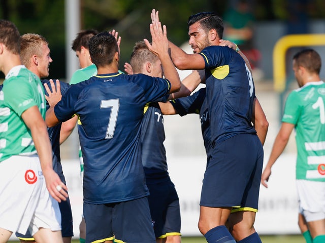 Graziano Pelle of Southampton celebrates with teammates after scoring his first goal during the pre-season friendly match between KSK Hasselt and Southampton at the Stedelijk Sportstadion on July 17, 2014