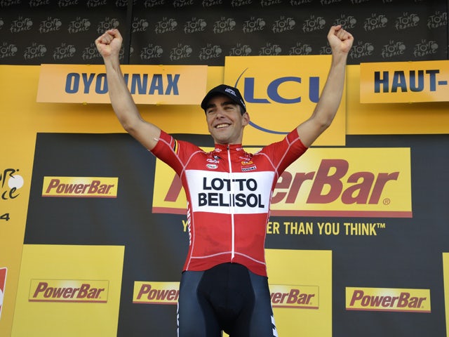 Stage winner France's Tony Gallopin celebrates on the podium after winning the 187.5 km eleventh stage of the 101st edition of the Tour de France cycling race on July 16, 201