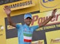 Stage winner Italy's Vincenzo Nibali celebrates on the podium after winning the 197.5 km thirteenth stage of the 101st edition of the Tour de France cycling race on July 18, 201