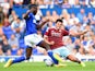 James Tomkins of West Ham United and Frank Nouble of Ipswich Town in action during the pre-season friendly match between Ipswich Town and West Ham United at Portman Road on July 16, 2014