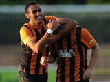 Ahmed Elmohamady of Hull City congratulates his team-mate Robbie Brady after he scored a goal during a pre-season friendly against Harrogate Town on July 21, 2014