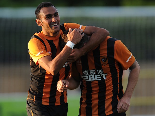 Ahmed Elmohamady of Hull City congratulates his team-mate Robbie Brady after he scored a goal during a pre-season friendly against Harrogate Town on July 21, 2014