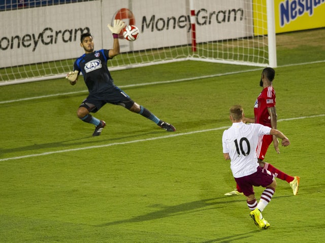Andreas Weimann #10 of Aston Villa scores a goal against Raul Fernandez #1of FC Dallas during an international friendly on July 23, 2014