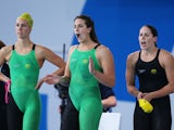Emma McKeon, Brittany Elmslie and Alicia Coutts of Australia cheer on team mate Bronte Baratt of Australia on their way to winning the gold medal in the Women's 4 x 200m Freestyle Relay Final at Tollcross International Swimming Centre during day three of 