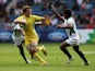 Con Foley of Australia is tackled by Sudharshana Muthutantri of Sri Lanka in the Rugby Sevens match between Australia and Sri Lanka at Ibrox Stadium during day three of the Glasgow 2014 Commonwealth Games on July 26, 2014