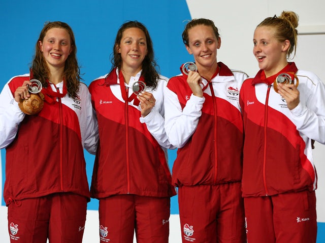 Becki Turner, Amy Smith, Francesca Halsall and Siobhan O'Connor of England pose with their silver medals during the medal ceremony for the Women's 4 x 100m Freestyle Relay Final at Tollcross International Swimming Centre during day one of the Glasgow 2014