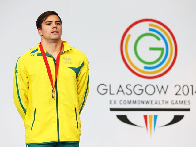 Gold medallist Ben Treffers of Australia stands on the podium during the medal ceremony for the Men's 50m Backstroke Final at Tollcross International Swimming Centre during day four of the Glasgow 2014 Commonwealth Games on July 27, 2014