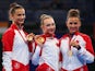 Gold medalists Annabelle Kovacs, Patricia Bezzoubenko and Maria Kitkarska of Canada pose on the podium after winning the rhythmic gymnastics Team event at the Glasgow Commonwealth Games on July 24, 2014
