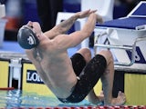 Chris Walker-Hebborn takes off at the start of the men's 100m backstroke final on July 25, 2014
