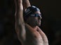 Chris Walker-Hebborn of England stretching before the men's 50m backstroke heat on July 26, 2014