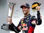 Daniel Ricciardo of Australia and Infiniti Red Bull Racing celebrates victory with the trophy on the podium after the Hungarian Formula One Grand Prix at Hungaroring on July 27, 2014