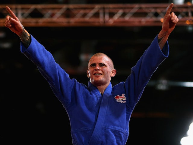 Danny Williams of England celebrates winning gold in the Men's -73kg Final - Gold Medal Contest on July 25, 2014