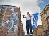 Euan Burton, multiple World and European medal winning judoka poses with the Scottish Saltire flag on September 21, 2014
