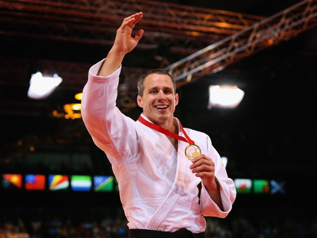 Gold medalist Euan Burton of Scotland on the podium during the medal ceremony for the Men's -100kg Judo final at the Scottish Exhibition and Conference Centre Precinct during day three of the Glasgow 2014 Commonwealth Games on July 26, 2014