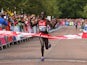 Flomena Cheyech Daniel of Kenya crosses the line to win gold in the Women's Marathon on the city marathon course during day four of the Glasgow 2014 Commonwealth Games on July 27, 2014