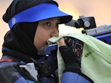 Malaysia's Halim Nur Ayuni Farhana Abdul prepares during the 10m air rifle final at the 25th Southeast Asian Games (SEAGAMES) at the National Sport Complex shooting range in Vientiane on December 10, 2009