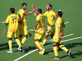 The Indian hockey team celebrate after demolishing Wales on july 25, 2014