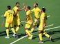 The Indian hockey team celebrate after demolishing Wales on july 25, 2014