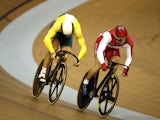 England's Jason Kenny and Australia's Peter Lewis compete in the men's sprint semi-final in the Sir Chris Hoy Velodrome during the 2014 Commonwealth Games in Glasgow, Scotland on July 25, 2014