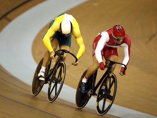 England's Jason Kenny and Australia's Peter Lewis compete in the men's sprint semi-final in the Sir Chris Hoy Velodrome during the 2014 Commonwealth Games in Glasgow, Scotland on July 25, 2014