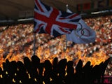 The Olympic Cauldron burns in front of the Union Jack and Olympic flag on Day 12 of the London 2012 Olympic Games at Olympic Stadium on August 8, 2012