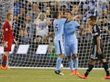 Dedryck Boyata #11 celebrates with Sergio Aguero #16 of Manchester City after scoring a goal past Jon Kempin #21 of Sporting KC during a penalty kick early in the second half on July 23, 2014