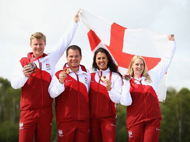 Men's Double Trap medalists Matthew French and Steven Scott pose with Women's Double Trap medalists Charlotte Kerwood and Rachel Parish at Barry Buddon Shooting Centre during day four of the Glasgow 2014 Commonwealth Games on July 27, 2014