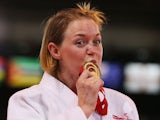 Gold medalist Megan Fletcher of England poses on the podium during the medal ceremony for the Women's -70kg Judo at SECC Precinct on July 24, 2014