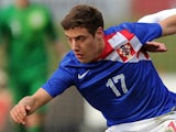 Nikola Vlasic of Croatia battles for the ball during the U18 International friendly match against England on March 5, 2014