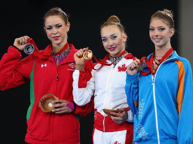 Medallists Patricia Bezzoubenko (Canada), Francesca Jones (Wales) and Themida Christodoulidou (Cyprus) after the individual clubs final on July 26, 2014