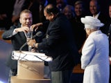 Prince Imran and Chris Hoy struggle to open the baton as The Queen watches on during the Commonwealth Games opening ceremony on July 23, 2014.