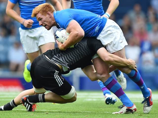 Scotland's Roddy Grant is tackled on July 26, 2014