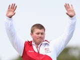 Rory Warlow of England celebrates winning the Bronze Medal in the Men's Skeet Shooting at Barry Buddon Shooting Centre during day three of the Glasgow 2014 Commonwealth Games on July 26, 2014