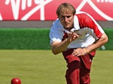 Sam Tolchard of England competes in the men's pairs at Kelvingrove Lawn Bowls Centre during day one of the Glasgow 2014 Commonwealth Games on July 24, 2014
