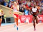 England's Sophie Papps and Khamica Bingham of Canada compete in the women's 100m heats at Hampden Park, Glasgow on day four of the 2014 Commonwealth Games on July 27, 2014