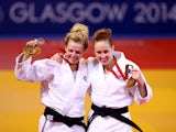 Silver medalist Stephanie Inglis of Scotland and bronze medalist Connie Ramsay of Scotland pose on the podium during the Womens -57kg medal ceremony at SECC Precinct during day one of the Glasgow 2014 Commonwealth Games on July 24, 2014