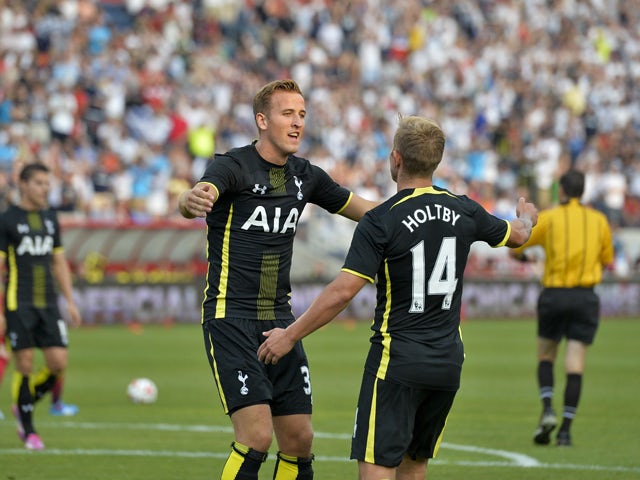 Harry Kane #37 (L) and Lewis Holtby #14 of Tottenham Hotspur celebrate Kane's goal against the Chicago Fire during the first half at Toyota Park on July 26, 2014