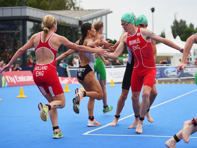 England's Vicky Holland hands over to Jonathan Brownlee in the mixed triathlon on July 26, 2014