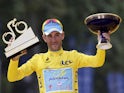 Tour de France 2014's winner Italy's Vincenzo Nibali poses on the podium on the Champs-Elysees avenue in Paris, at the end of the 137.5 km twenty-first and last stage of the 101st edition of the Tour de France cycling race on July 27, 2014