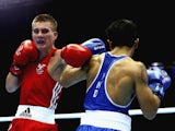 Ashley Williams competes against Devendro Liashram of India during the Men's Light Fly 46-49kg Semi-Finals Boxing at Scottish Exhibition And Conference Centre during day nine of the Glasgow 2014 Commonwealth Games on August 1, 2014