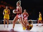 Chelsea Lewis of Wales secures posession as Laura Geitz of Australia falls over during the Preliminary Round Group B match between Australia and Wales at SECC Precinct during day one of the Glasgow 2014 Commonwealth Games on July 24, 2014
