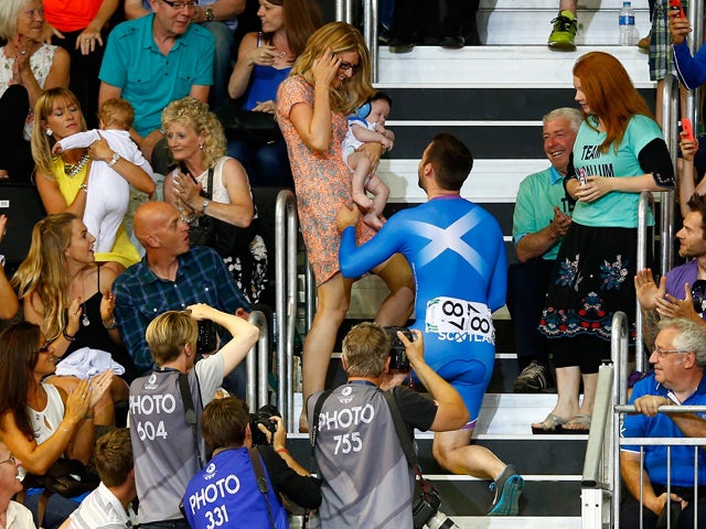 Cyclist Chris Pritchard of Scotland proposes to his partner during competition at the Sir Chris Hoy Velodrome during day four of the Glasgow 2014 Commonwealth Games on July 27, 2014