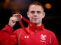 Craig Pilling of Wales celebrates with his medal after the 57kg Freestyle Wrestling Bronze medal match at Scottish Exhibition And Conference Centre during day six of the Glasgow 2014 Commonwealth Games on July 29, 2014