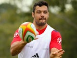 French rugby player Damien Chouly (R) throws the ball during the first training session at Anglican Church Grammar School in Brisbane, May 30, 2014