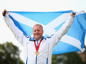 Scotland's Burnett wins lawn bowls gold